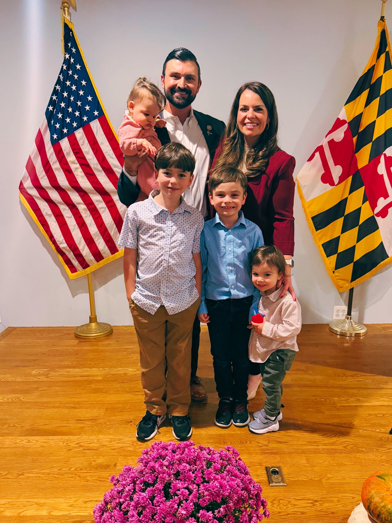 The Nawrocki family with the American and Maryland flags