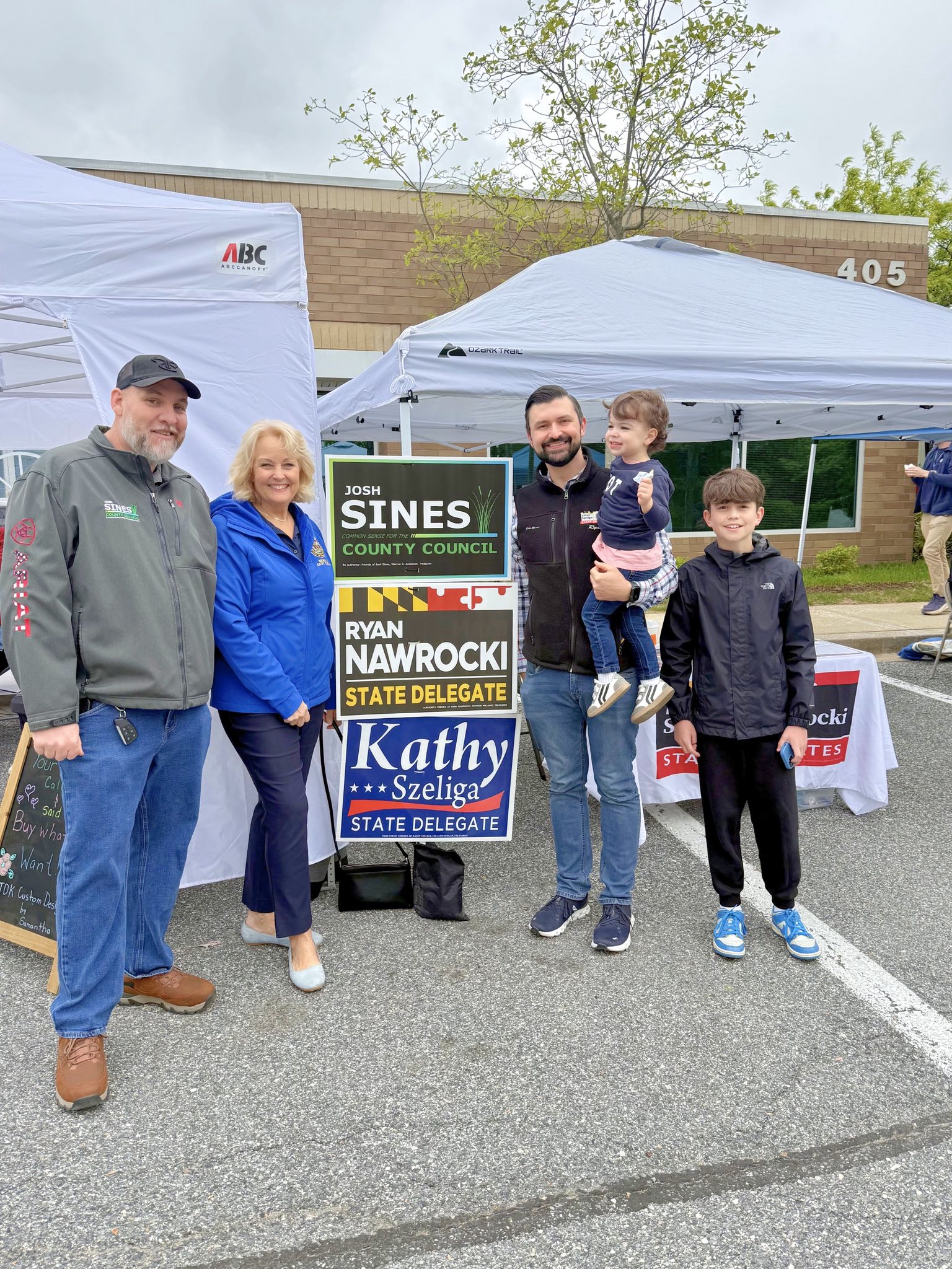 Ryan with families and officials at a District 7A campaign booth