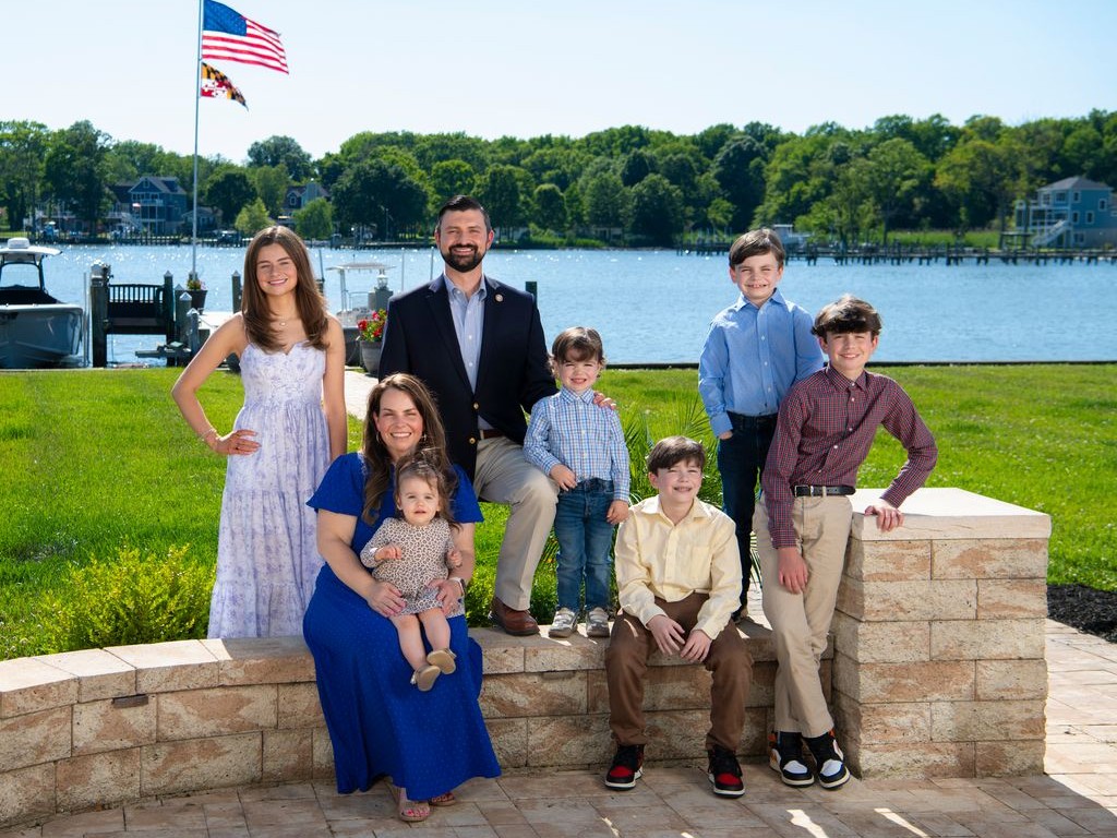 Ryan and Dr. Lauren Nawrocki with their six children on the Baltimore County waterfront